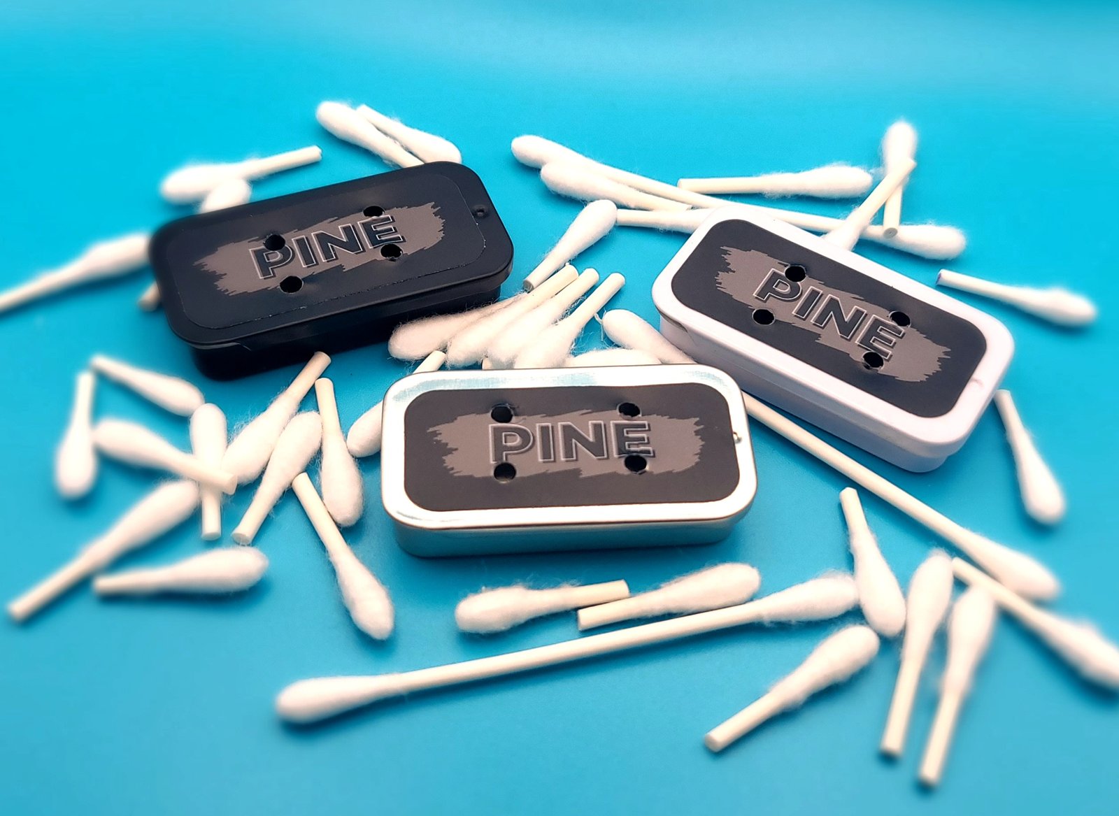 3 pine tins among swabs